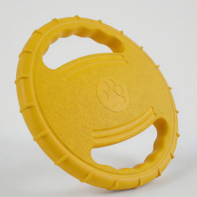 Frisbee blando amarillo visto en ángulo, con sus dos asas