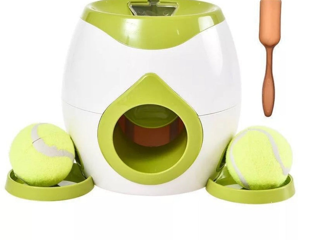 Lanzapelotas en color verde con sus pelotas y la cuchara